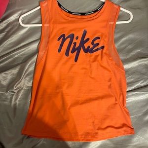 Nike. muscles tee , tangy orange . small in women